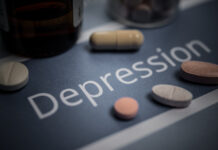 Bild på texten "Depression" och piller.